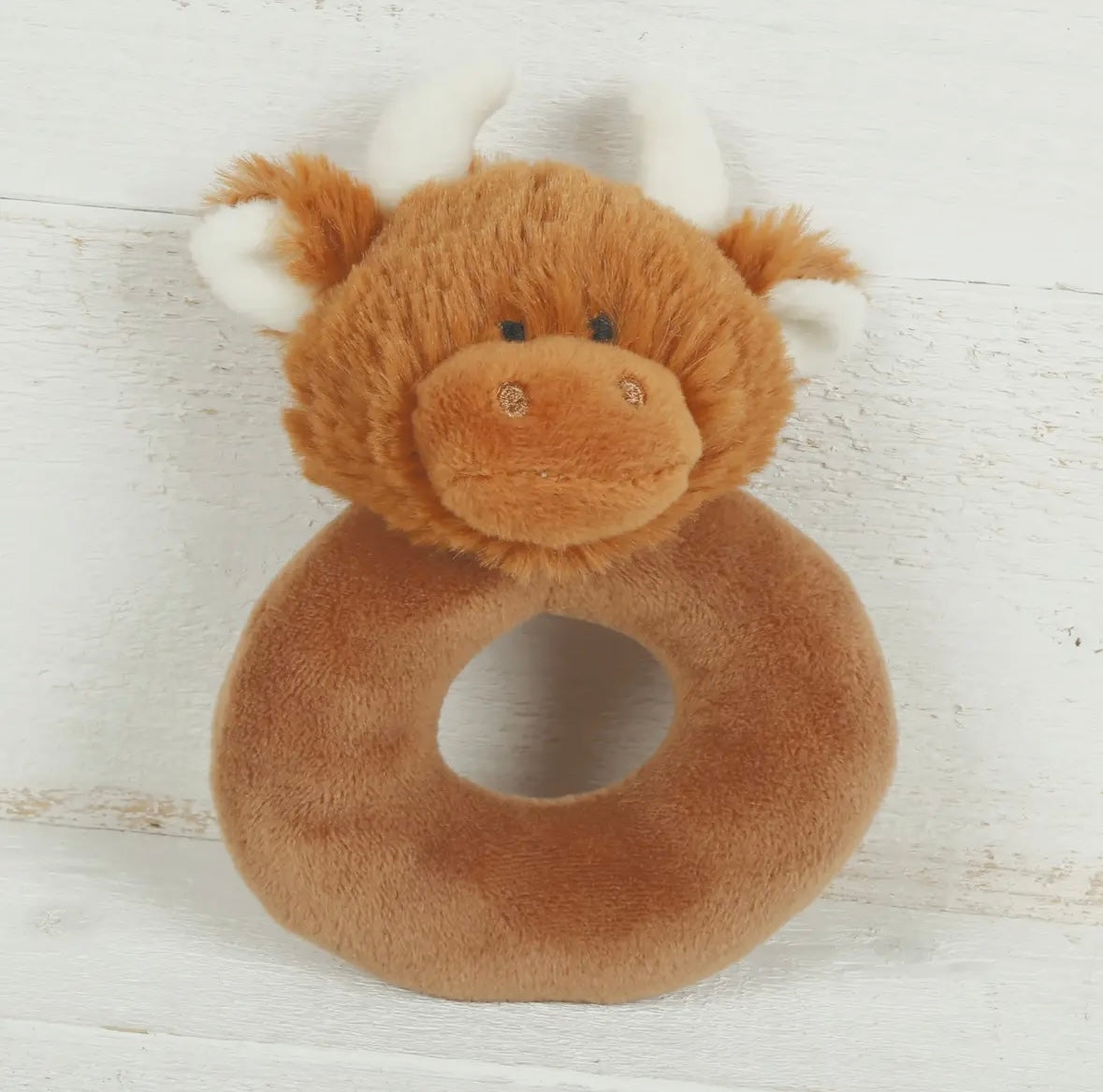 Close-up of the Scottish Highland Cow Baby Plush Rattle showcasing its soft fur and adorable facial features.